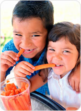 Kids eating carrots