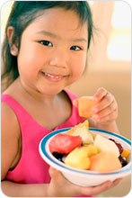 Girl eating fruit